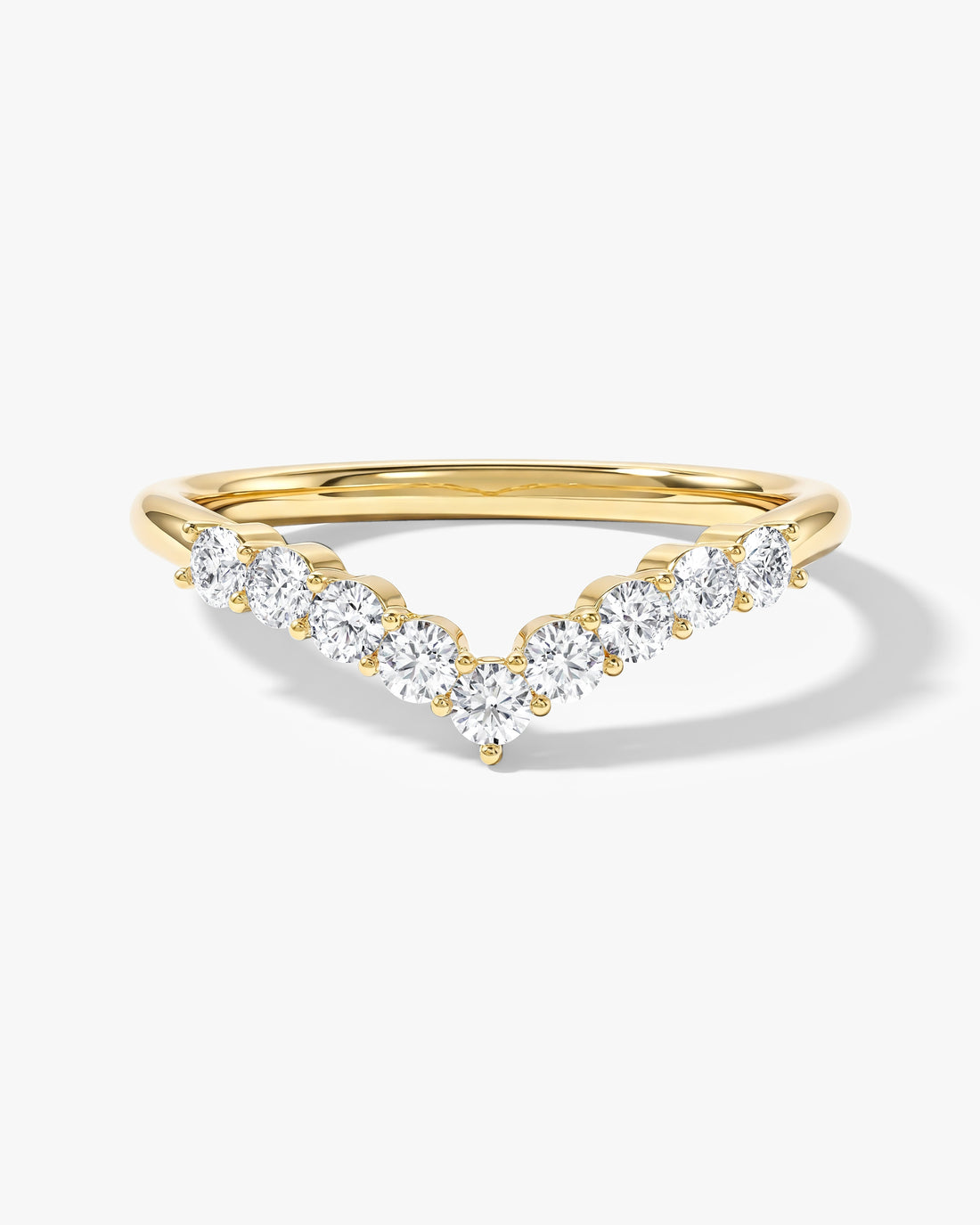 Round moissanite shared prong chevron wedding band in yellow gold