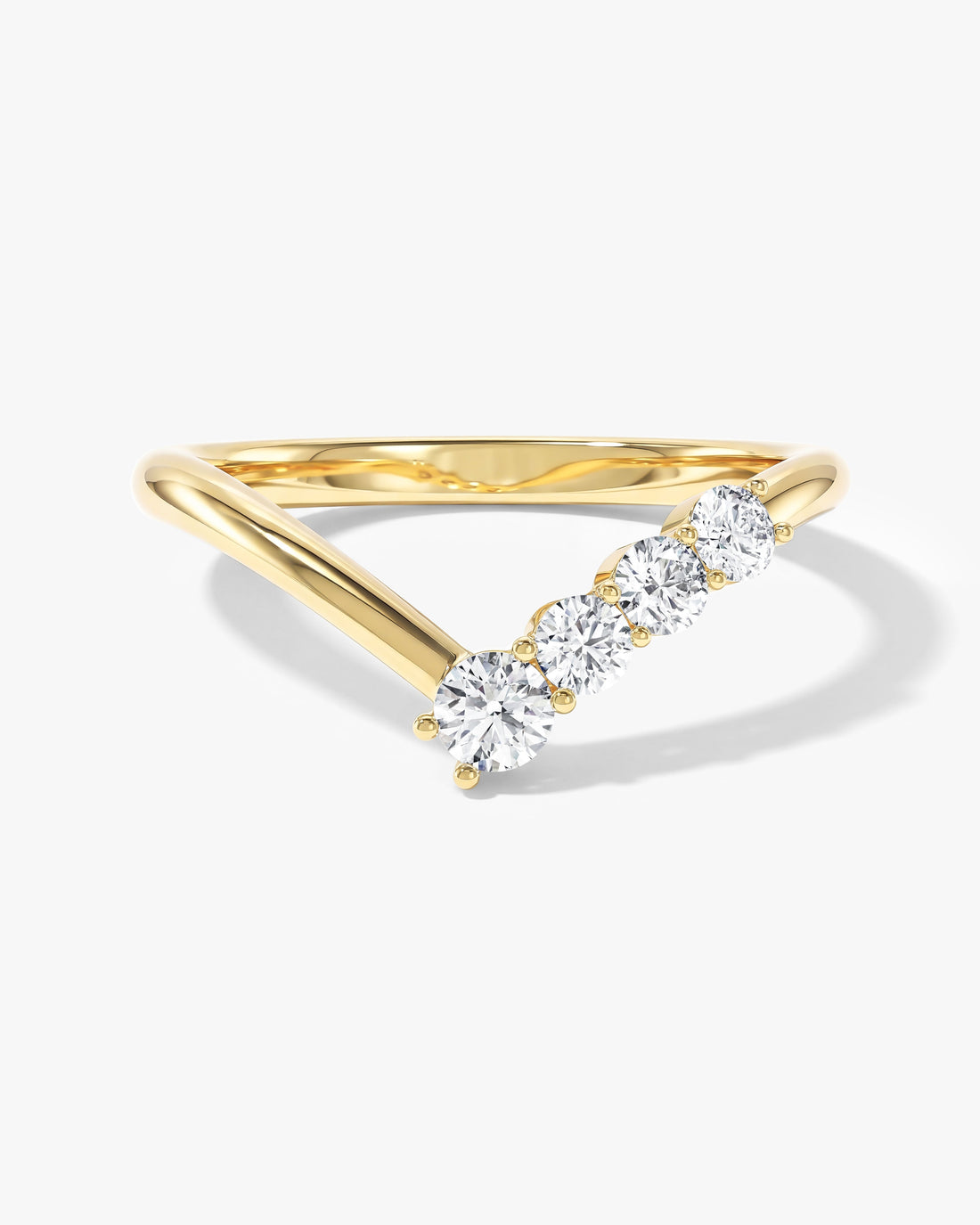 Round moissanite asymmetric chevron wedding band in yellow gold