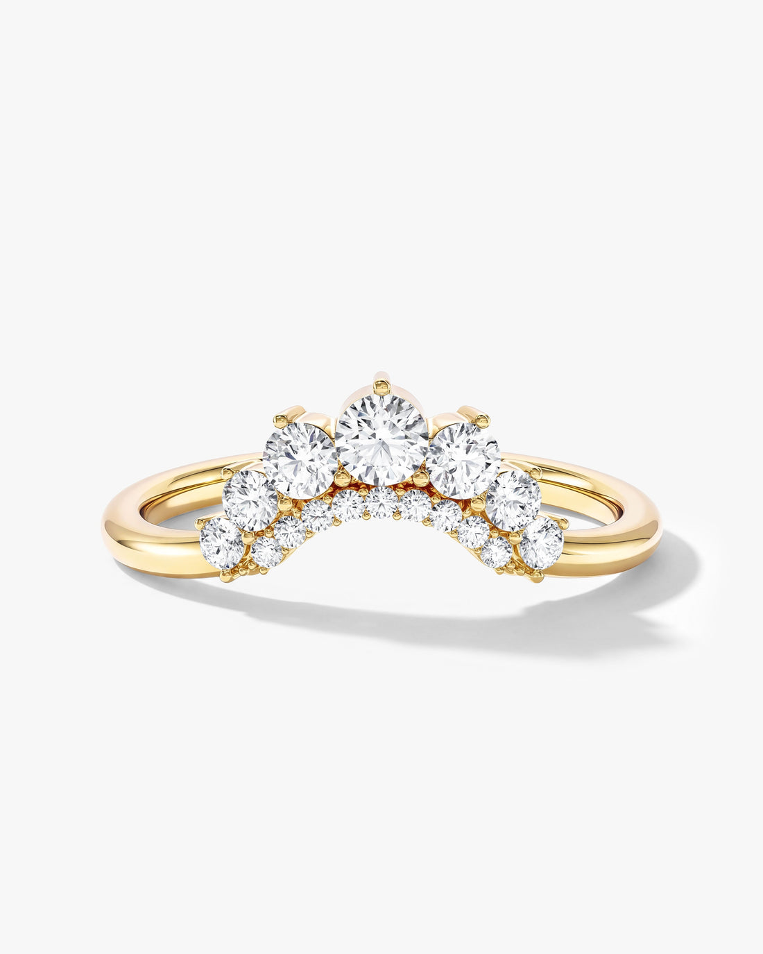Round moissanite pave accent arched wedding band in yellow gold