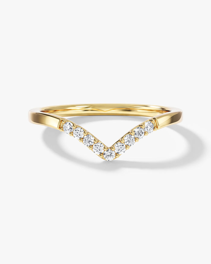 Round moissanite nine stone curved wedding band in yellow gold, front view