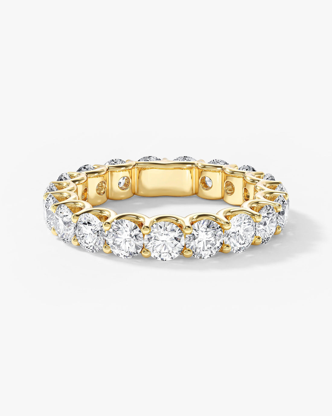 Round moissanite U-prong full eternity wedding band in yellow gold