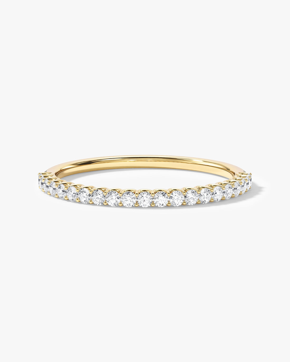 Round moissanite U-prong half eternity wedding band in yellow gold