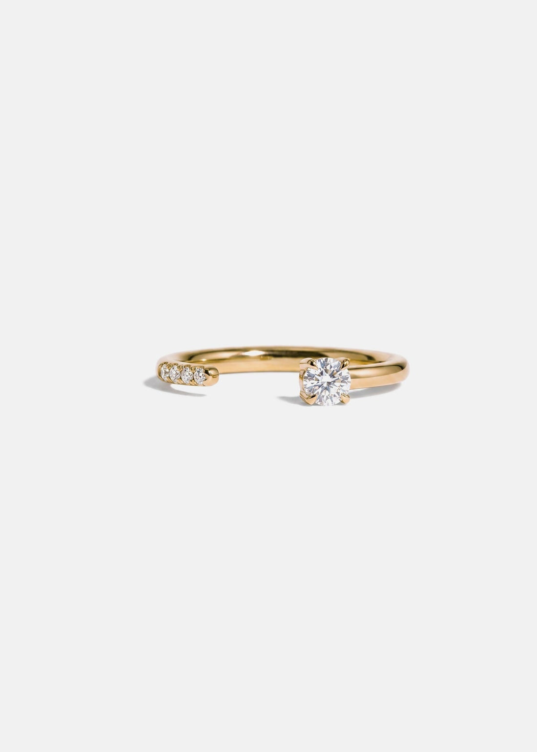 Round lab grown diamond open shank wedding band in yellow gold