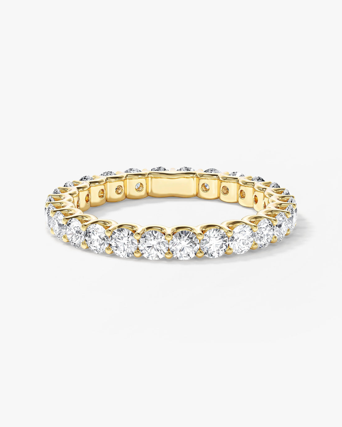 Round moissanite U-prong full eternity wedding band in yellow gold