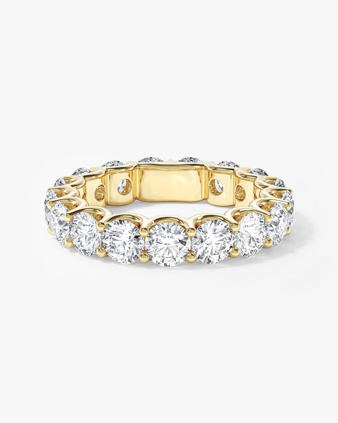 Round moissanite U-prong full eternity wedding band in yellow gold