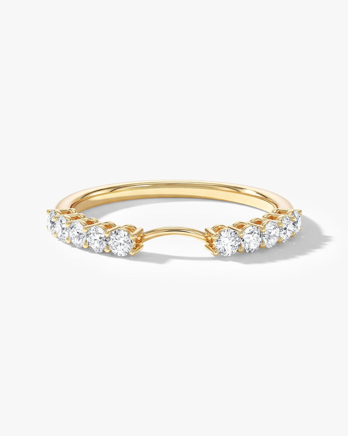 Aura curved nesting wedding band with round moissanite and an arched center opening in yellow gold