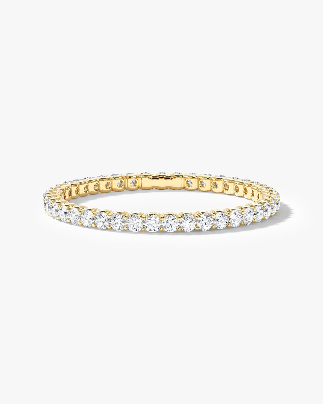Round moissanite U-prong full eternity wedding band in yellow gold