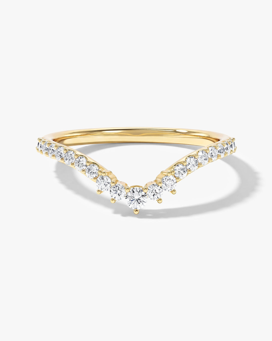 Harmony V-shaped curved nesting wedding band with round moissanite in yellow gold, front view