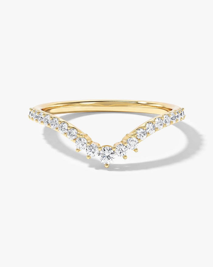 Harmony V-shaped curved nesting wedding band with round moissanite in yellow gold, front view