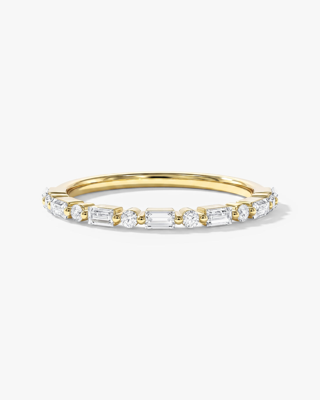 Alternating round and baguette moissanite wedding band in yellow gold, front view