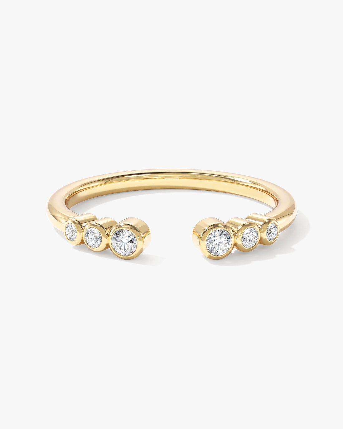 Round moissanite graduated bezel open cuff wedding band in yellow gold