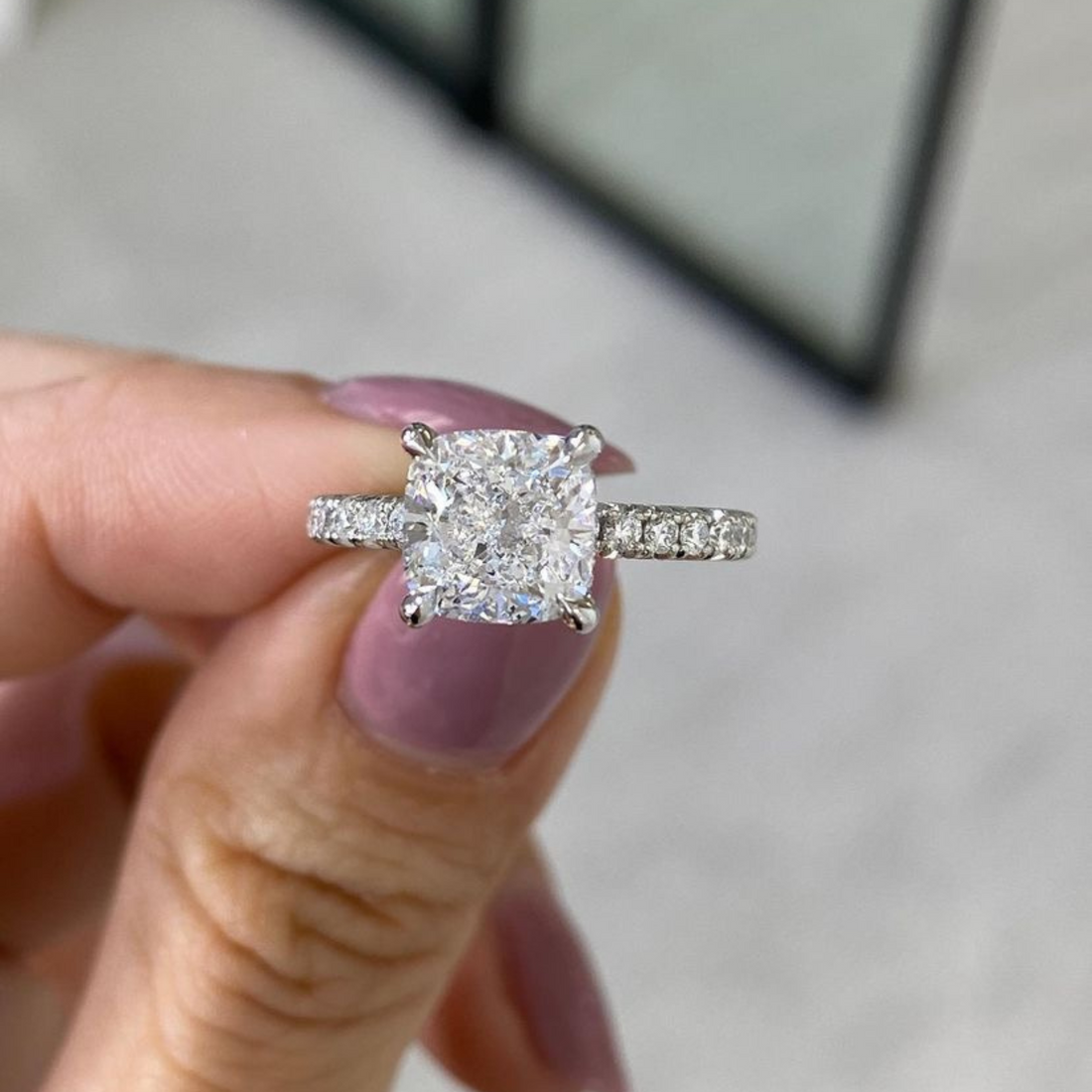 Cushion cut moissanite prong set engagement ring in gold