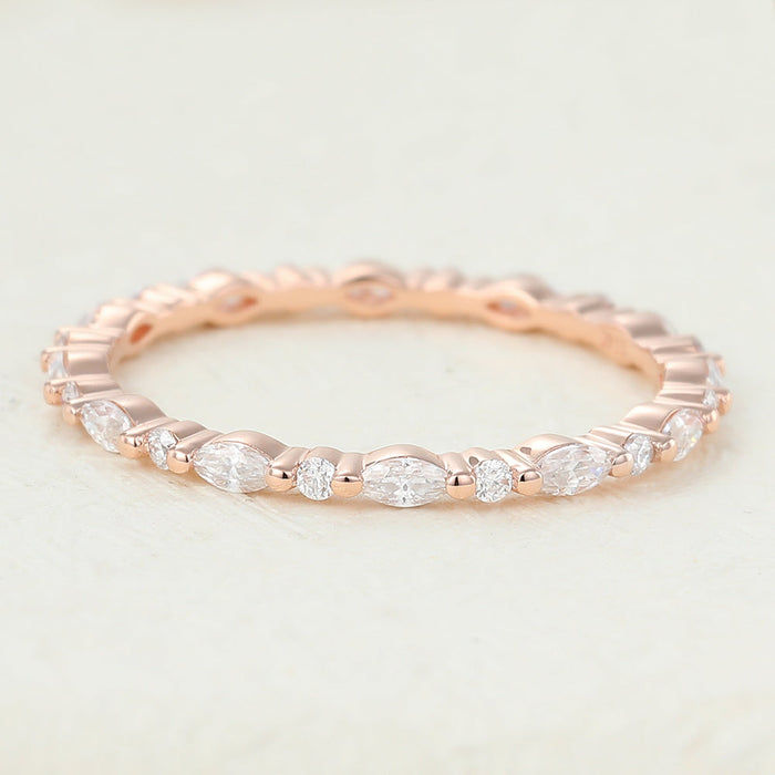 Rose gold eternity band with marquise stones alternating with small round stones, front view