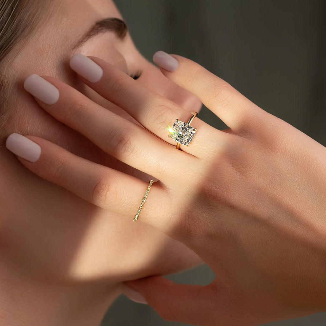 Cushion cut lab grown diamond ring set low on a fine rose gold band