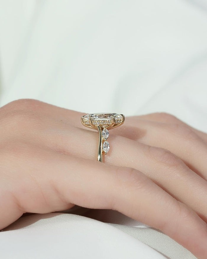 Marquise cut moissanite bypass accent ring side profile in 14K yellow gold