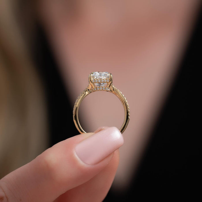Cushion cut moissanite hidden halo twisted pave ring side profile in 14K yellow gold
