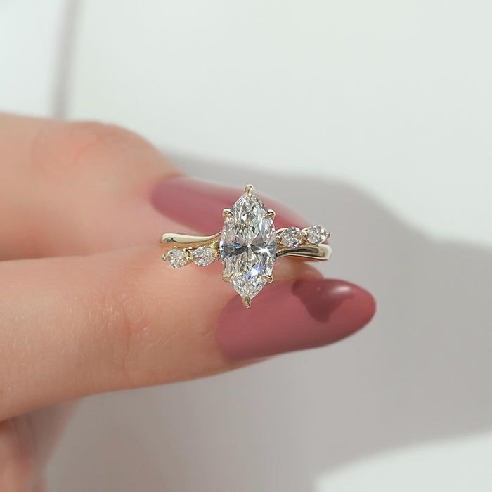 Marquise moissanite hidden halo ring with vine accents in yellow gold