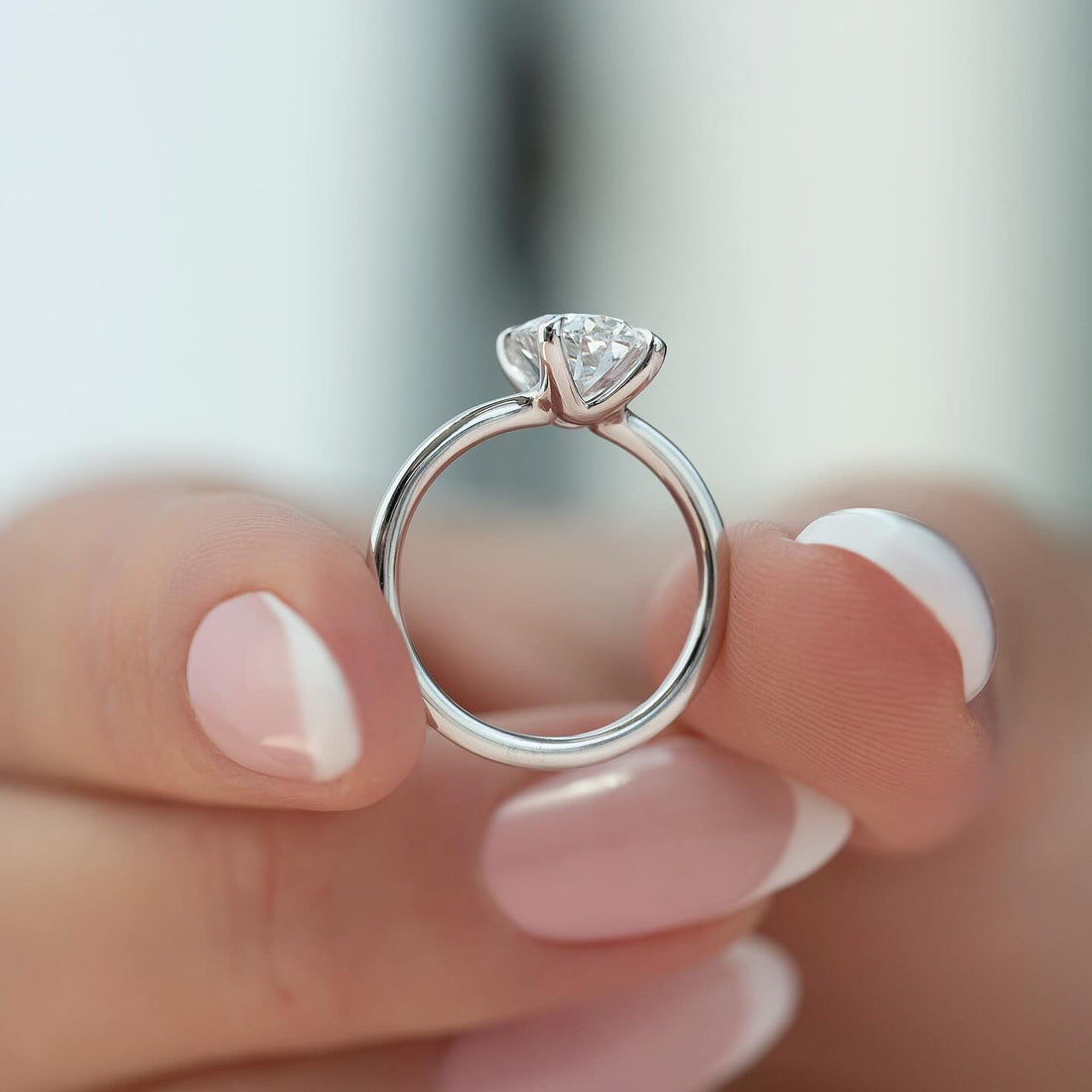 Round brilliant lab grown diamond solitaire ring in white gold with a cathedral shank