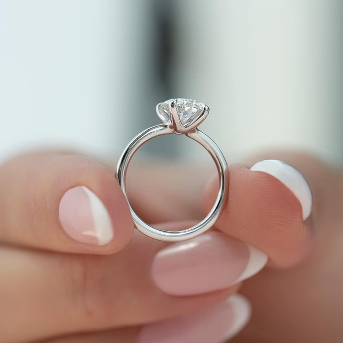 Round brilliant lab grown diamond solitaire ring in white gold with a cathedral shank