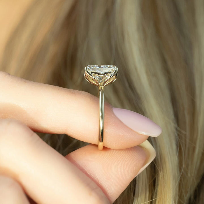 Tulip petal claws forming the basket beneath the cushion diamond