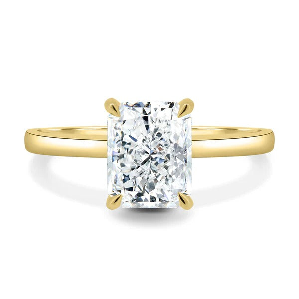 Elongated radiant cut lab grown diamond four claw solitaire ring