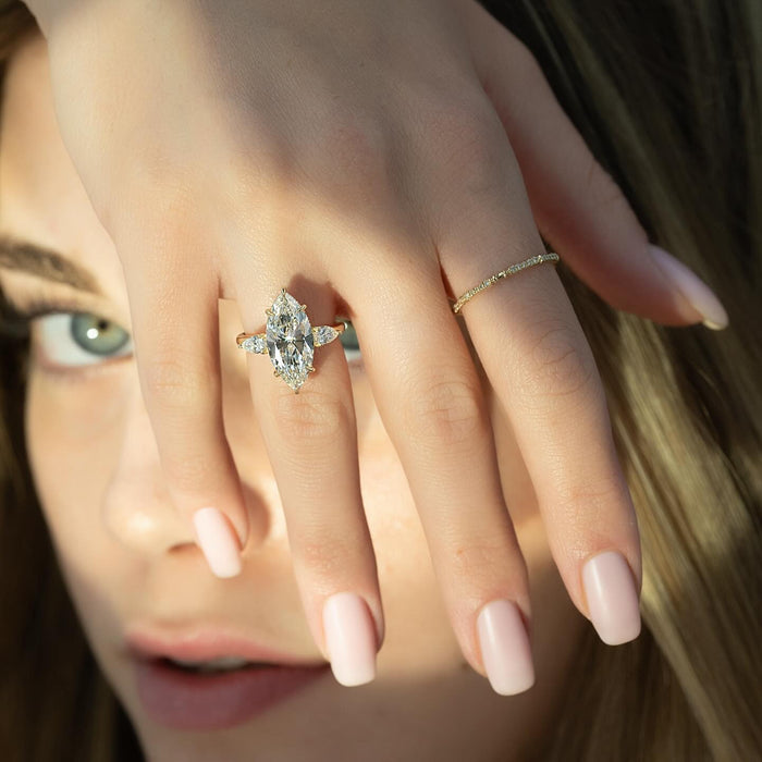 Marquise three stone diamond ring worn on the hand