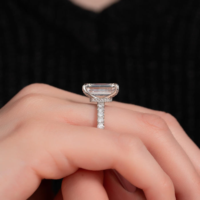 Emerald cut lab grown diamond set sideways on a pave band