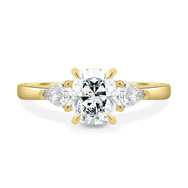 Elongated cushion cut lab grown diamond three stone ring with pear side stones