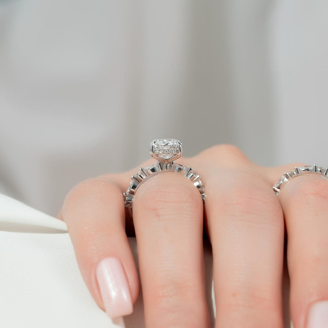 Elongated cushion moissanite hidden halo bridal set side view in white gold
