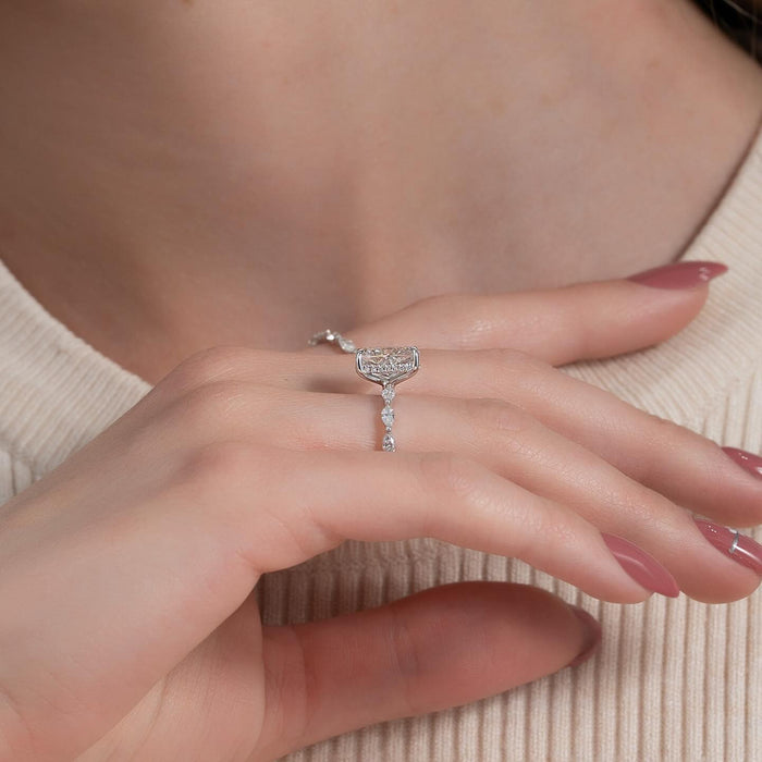Side profile showing the hidden halo under the elongated cushion diamond