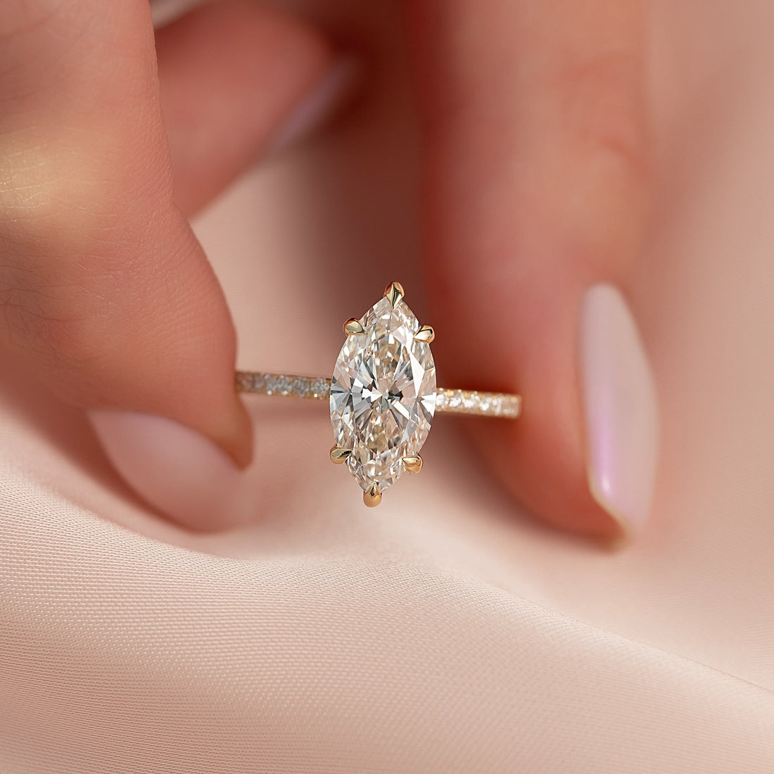 Marquise cut lab grown diamond ring with micro pave band in yellow gold