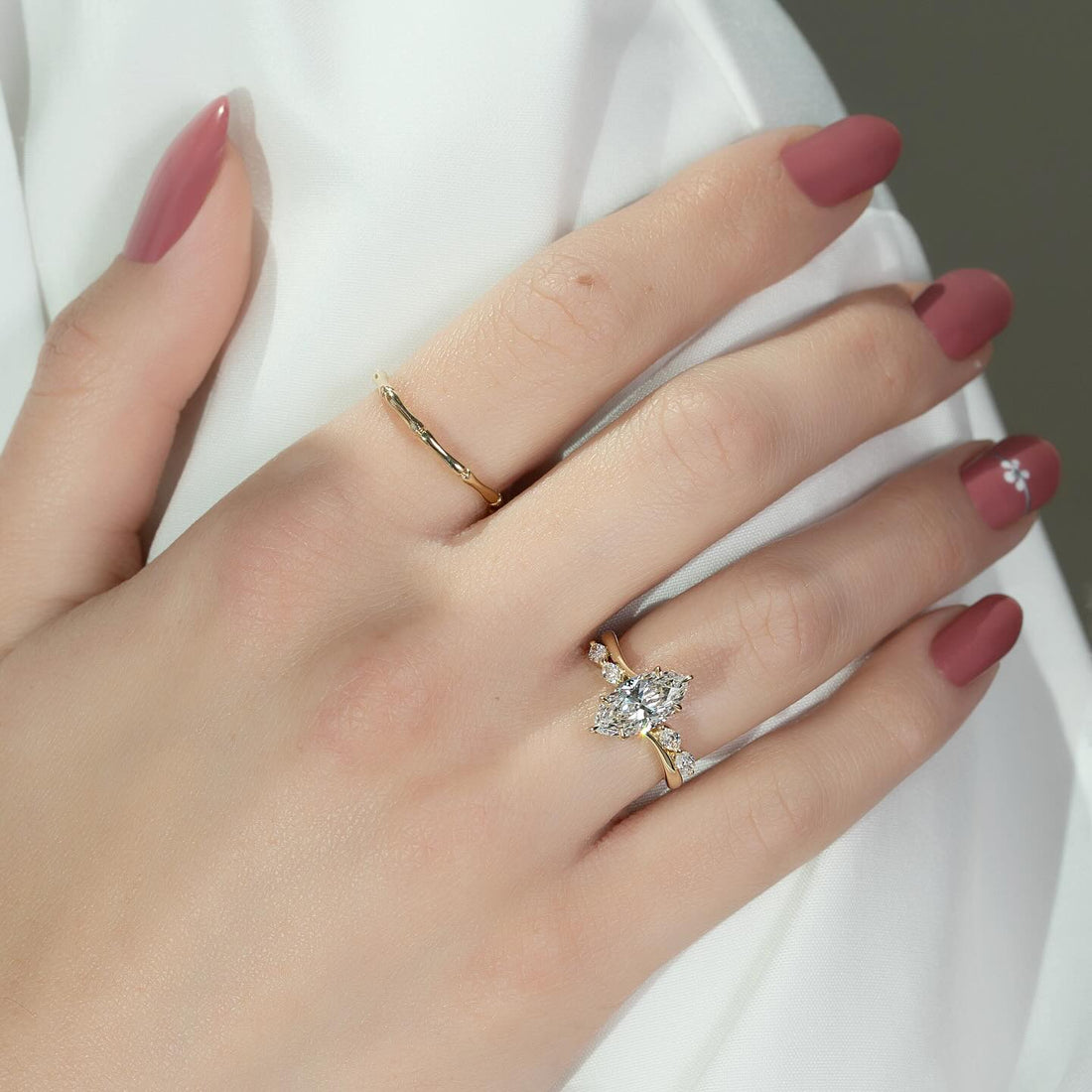 Marquise lab grown diamond vine ring in yellow gold worn on the hand