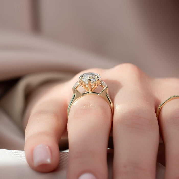 Marquise moissanite three stone half moon ring side view in yellow gold