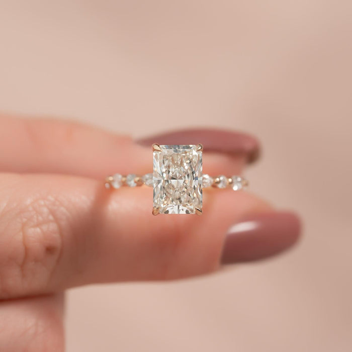 Radiant moissanite hidden halo shared prong band ring in rose gold