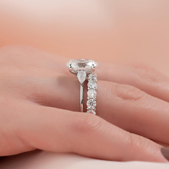 Engagement ring and matching shared claw diamond band stacked together