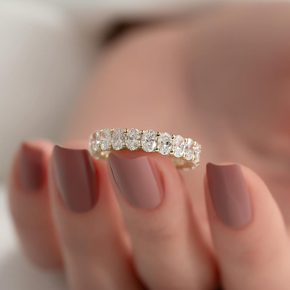 Round moissanite U-prong eternity band detail