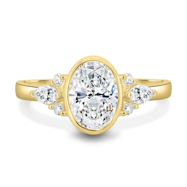 Oval cut lab grown diamond bezel set ring with floating pear accents