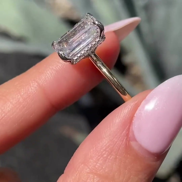 2.5ct emerald cut moissanite hidden halo engagement ring in solid gold