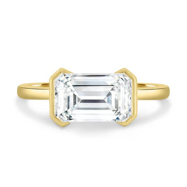 Emerald cut lab grown diamond east west half bezel solitaire ring