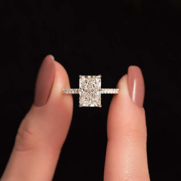 Radiant cut moissanite solitaire ring with pave band in rose gold