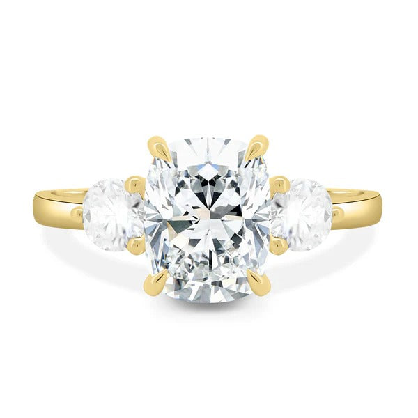 Elongated cushion cut lab grown diamond three stone ring with round side stones