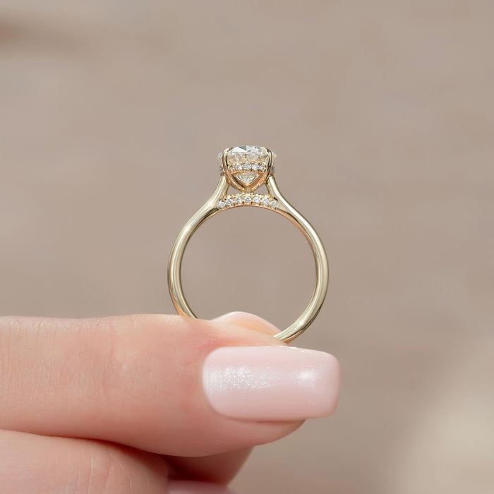 Profile showing both hidden pave rows beneath the oval diamond