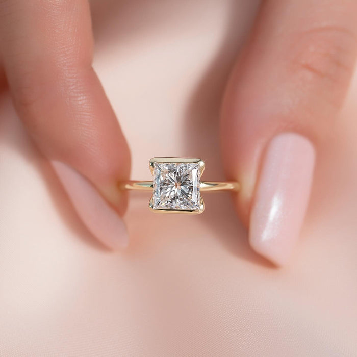 Princess cut lab grown diamond half bezel solitaire ring in yellow gold