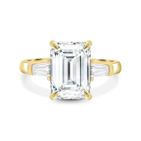 Emerald cut lab grown diamond three stone ring with tapered baguette sides