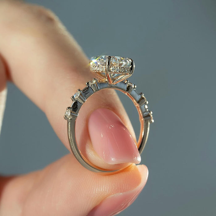Pear cut lab grown diamond ring with hidden halo and graduated shoulder diamonds