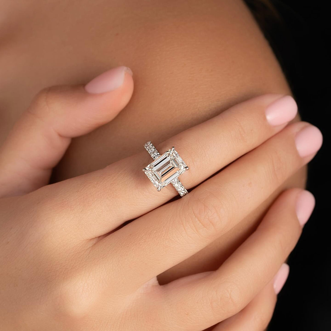 East west emerald cut lab grown diamond ring with slim pave shank in white gold
