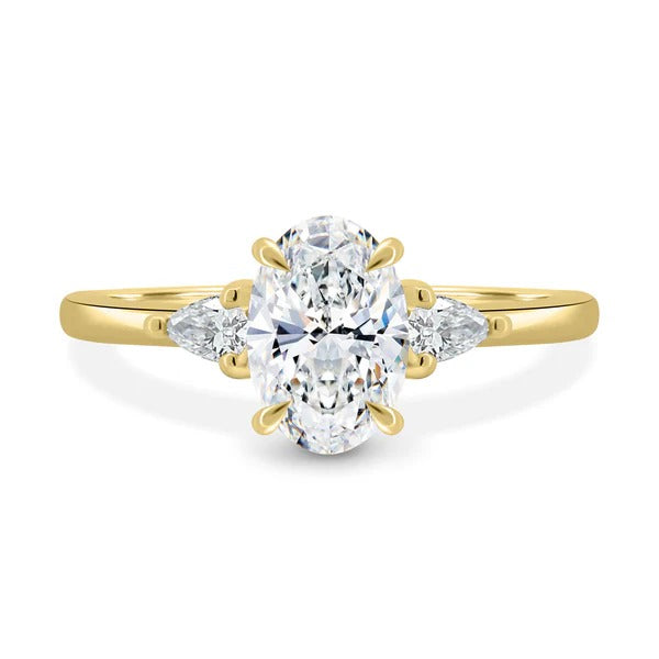 Oval cut lab grown diamond three stone ring with pear side stones