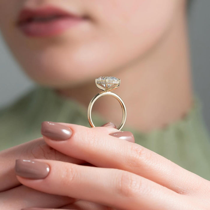 Oval moissanite hidden halo classic band ring profile in yellow gold