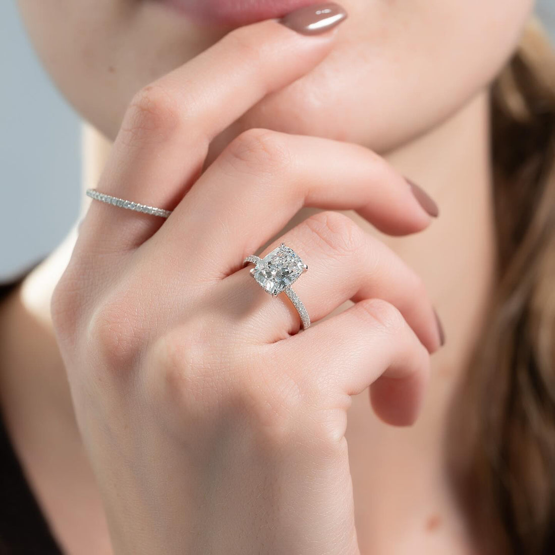 Elongated cushion lab grown diamond ring with hidden halo and pave shank in white gold