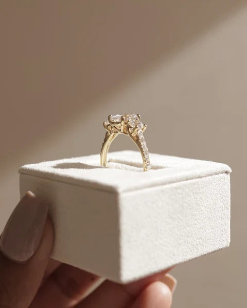 Oval trilogy lab grown diamond ring round side stone detail